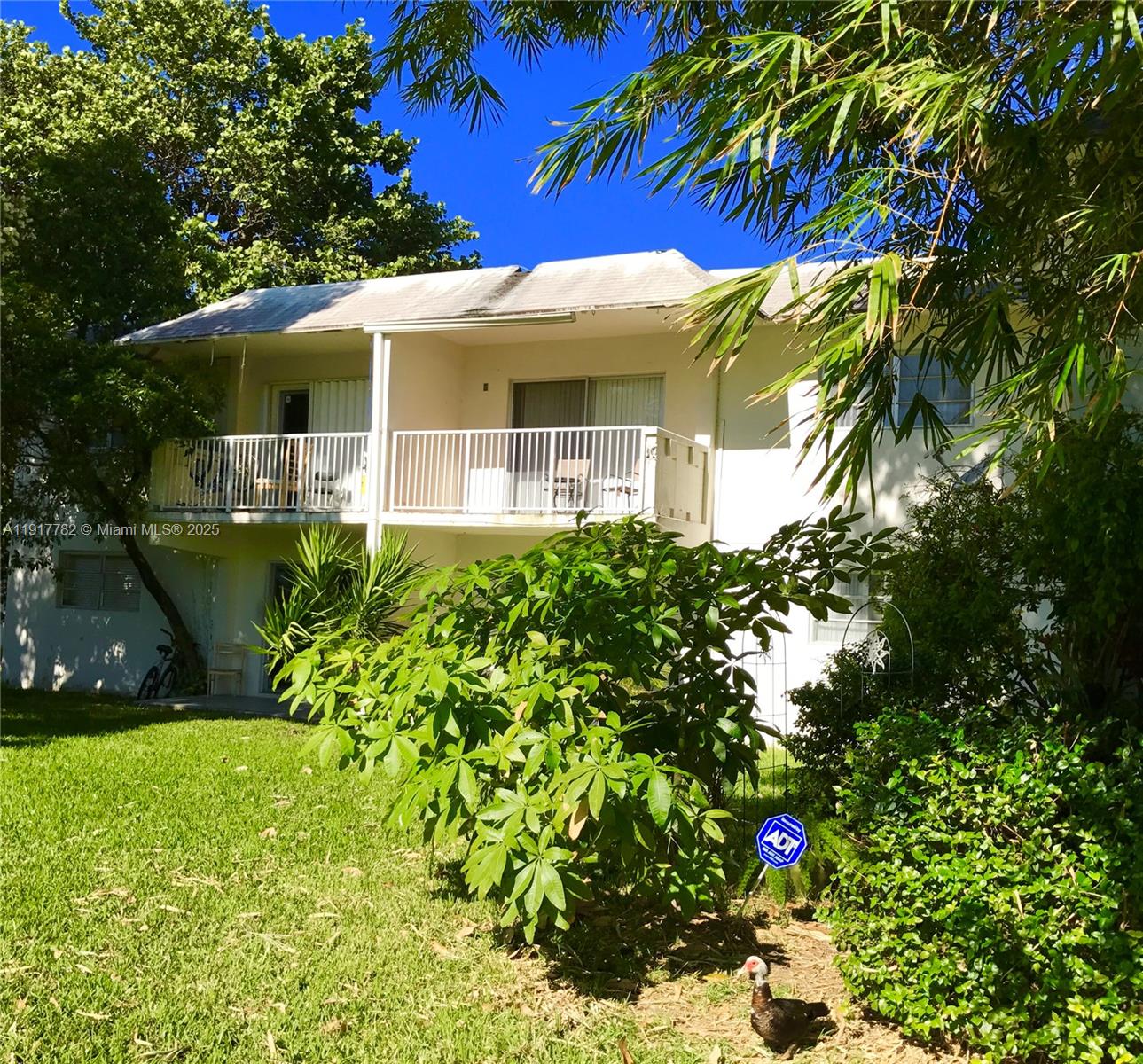 7328 Southwest 82nd Street, Unit B213 Miami, FL 33143 - Photo 21 of 22 a front view of a house with a yard