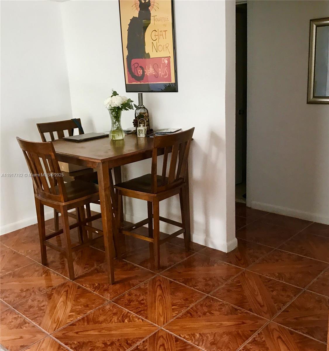 7328 Southwest 82nd Street, Unit B213 Miami, FL 33143 - Photo 10 of 22 a view of a dining room with furniture
