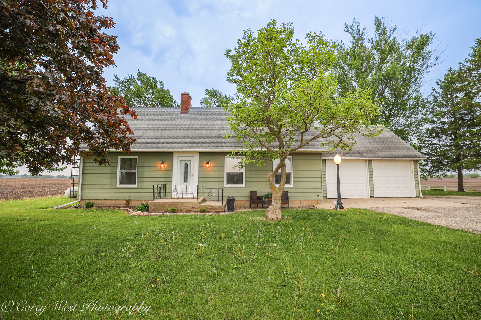 8994 Highway 64 Sycamore, IL 60178 - Photo 1 of 37 a front view of house with yard and trees