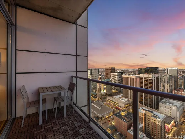 a balcony with a city view
