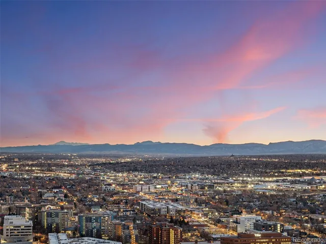 a view of a entryway with furniture and wooden floor