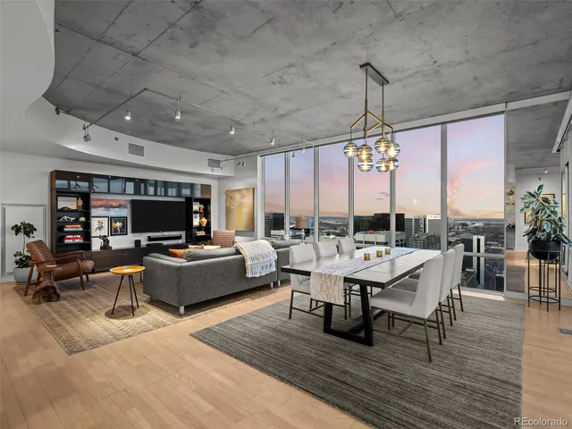 a living room with lots of furniture and a flat screen tv