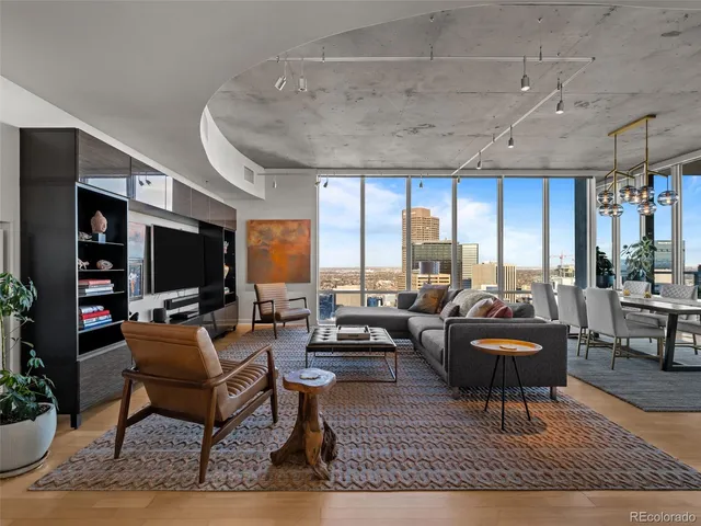 a living room with furniture fireplace and a flat screen tv