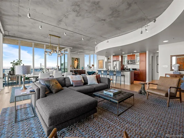 a dining room with furniture window and wooden floor