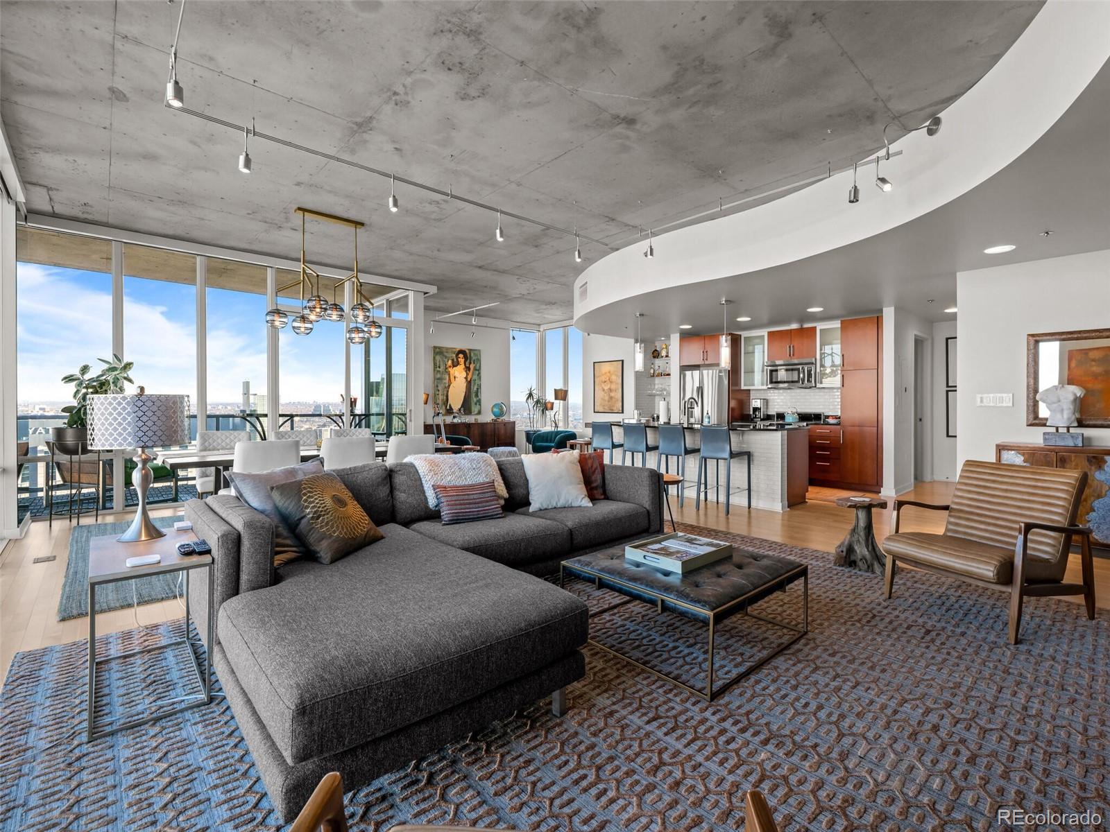 891 14th Street, Unit 4109 Denver, CO 80202 - Photo 9 of 50 a living room with furniture wooden floor and a table
