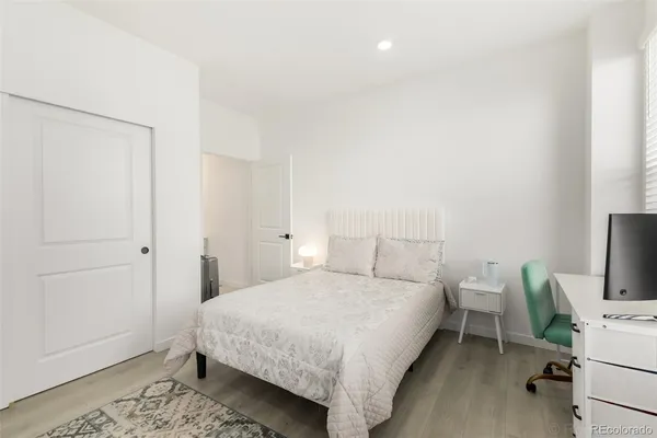 a bedroom with a bed and a table in it
