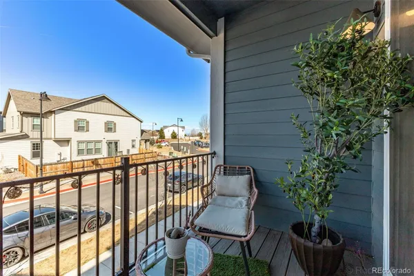 a view of a chair and table in the balcony