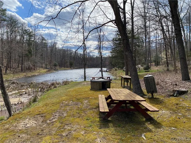 a view of a backyard with chairs and a slide