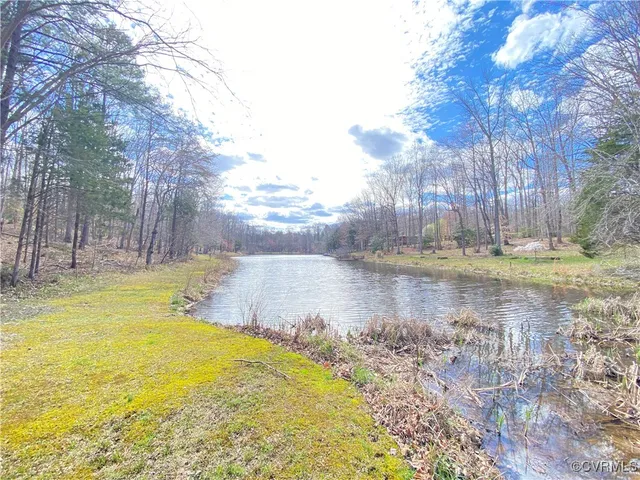 a swimming pool with trees in the background