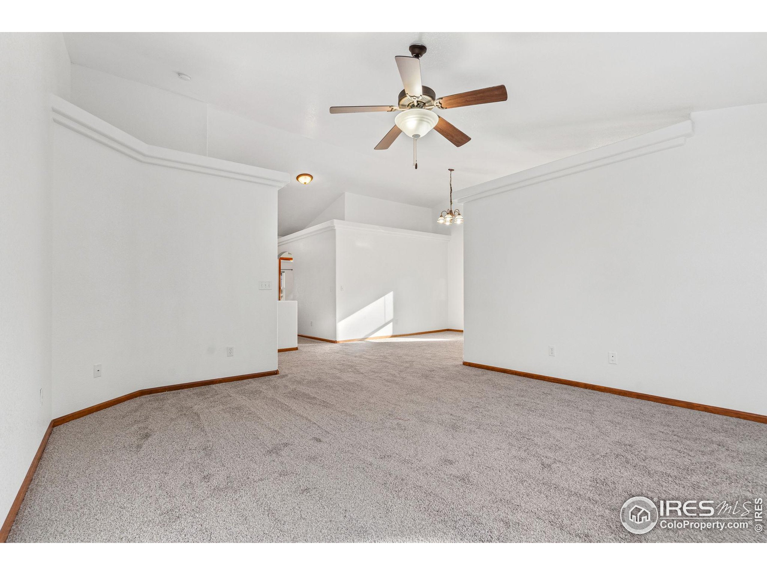 2239 Muir Lane Fort Collins, CO 80524 - Photo 12 of 31 a view of an empty room with a ceiling fan