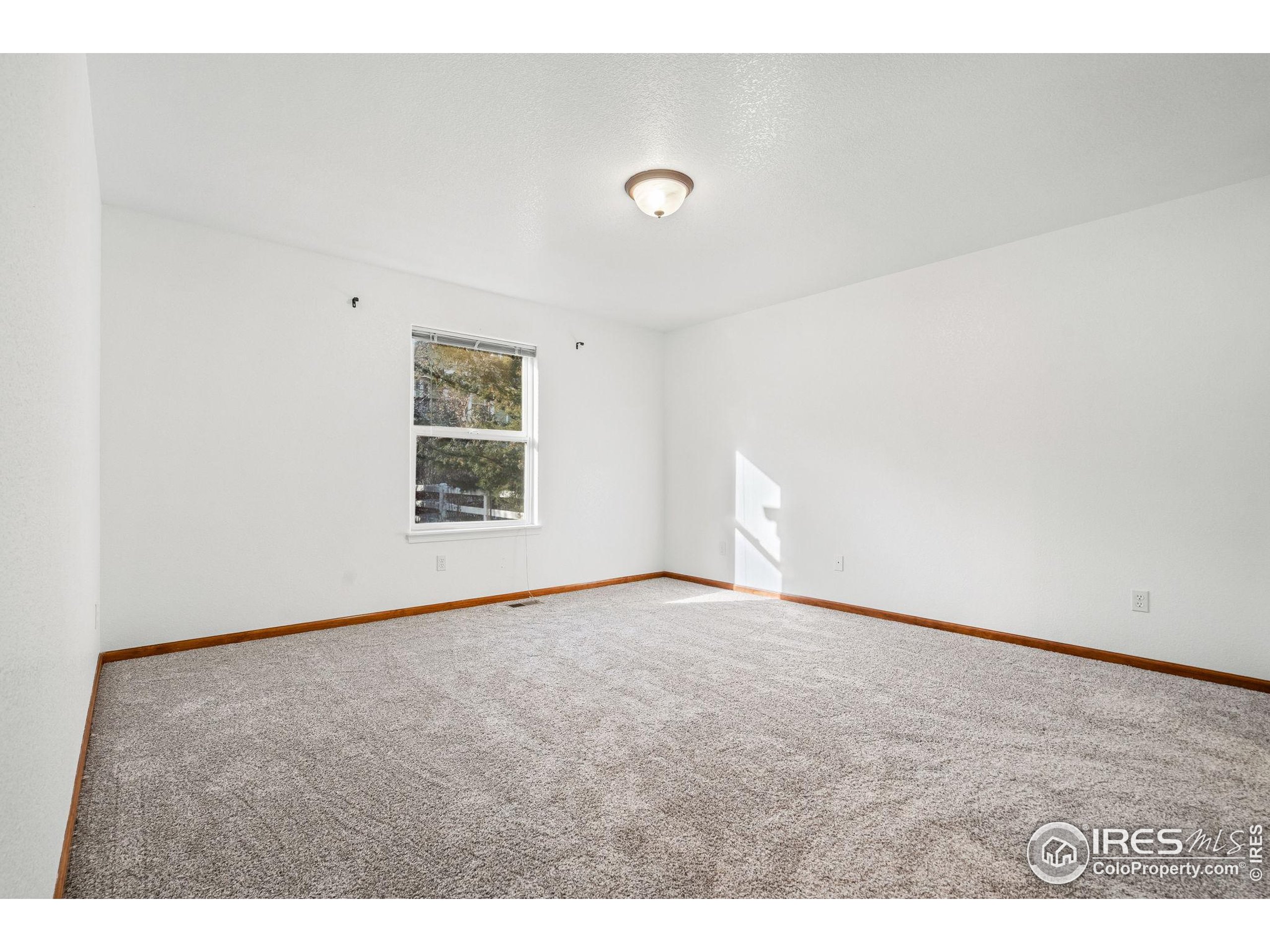 2239 Muir Lane Fort Collins, CO 80524 - Photo 15 of 31 a view of an empty room with a window