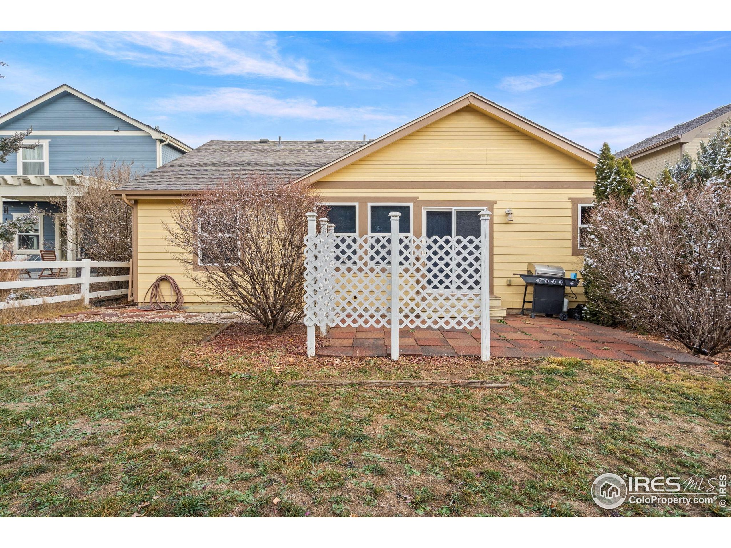 2239 Muir Lane Fort Collins, CO 80524 - Photo 27 of 31 a front view of a house with a yard