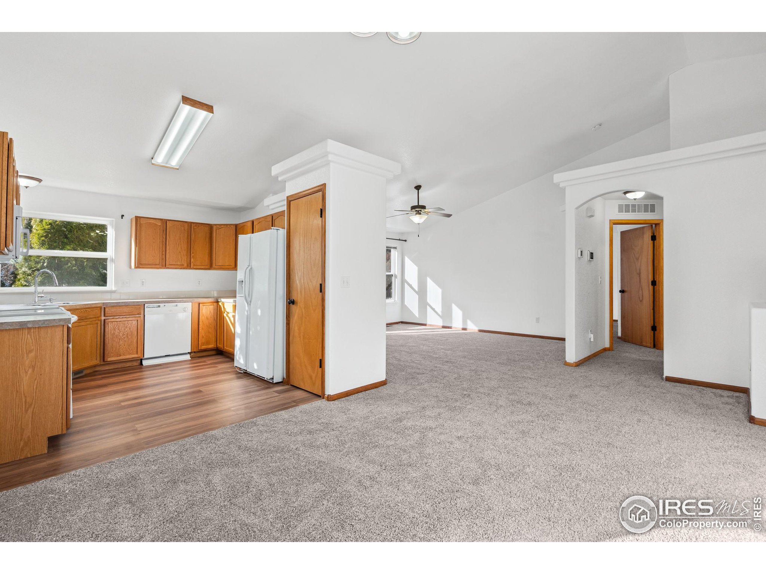 2239 Muir Lane Fort Collins, CO 80524 - Photo 8 of 31 a living room with furniture and a kitchen