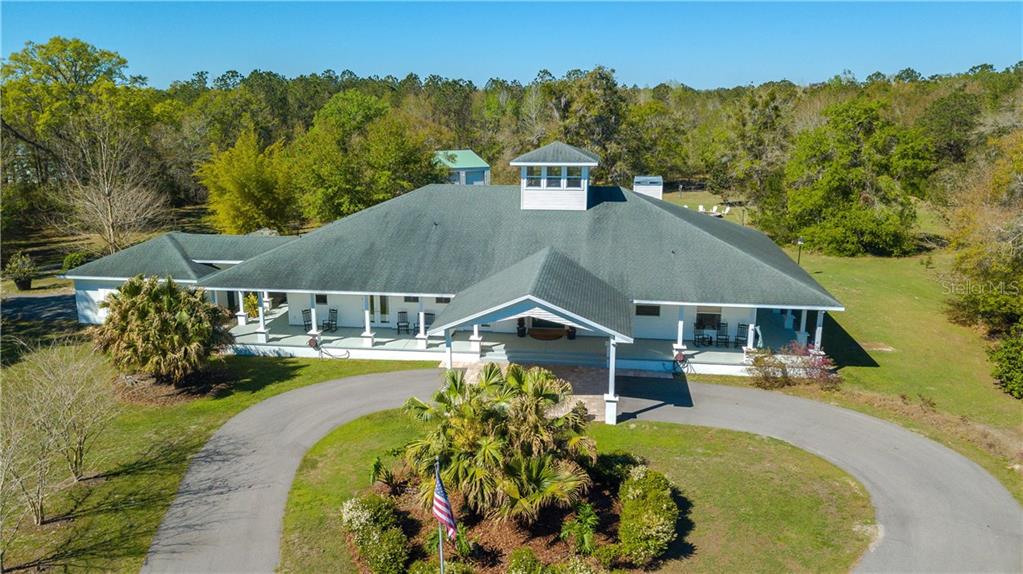 2845 Saturn Road Brooksville, FL 34604 - Photo 1 of 1 an aerial view of a house with swimming pool garden and patio