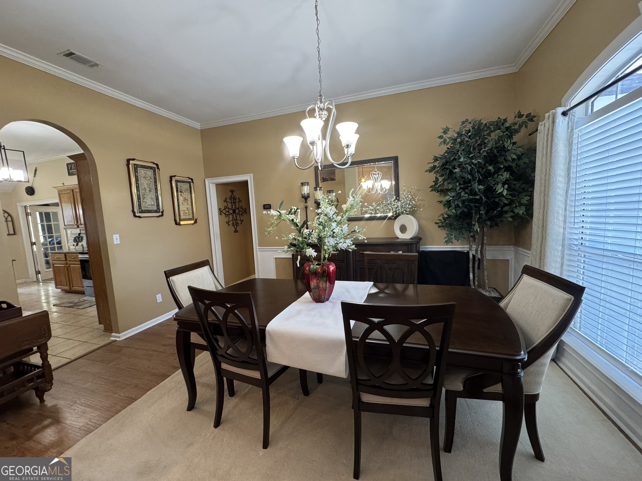 4633 Rustic Ridge Road Valdosta, GA 31602 - Photo 11 of 46 a view of a dining room with furniture and chandelier