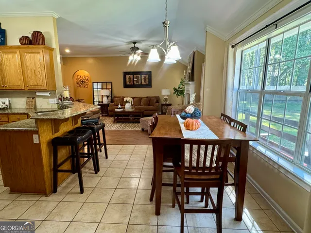 a outdoor dining space with furniture and a potted plant