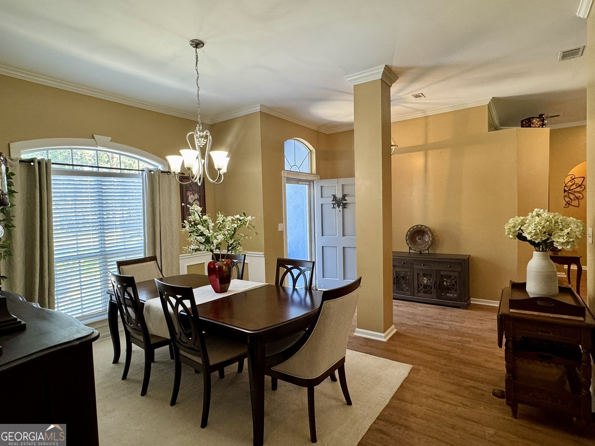 4633 Rustic Ridge Road Valdosta, GA 31602 - Photo 22 of 46 a view of a dining room with furniture and wooden floor
