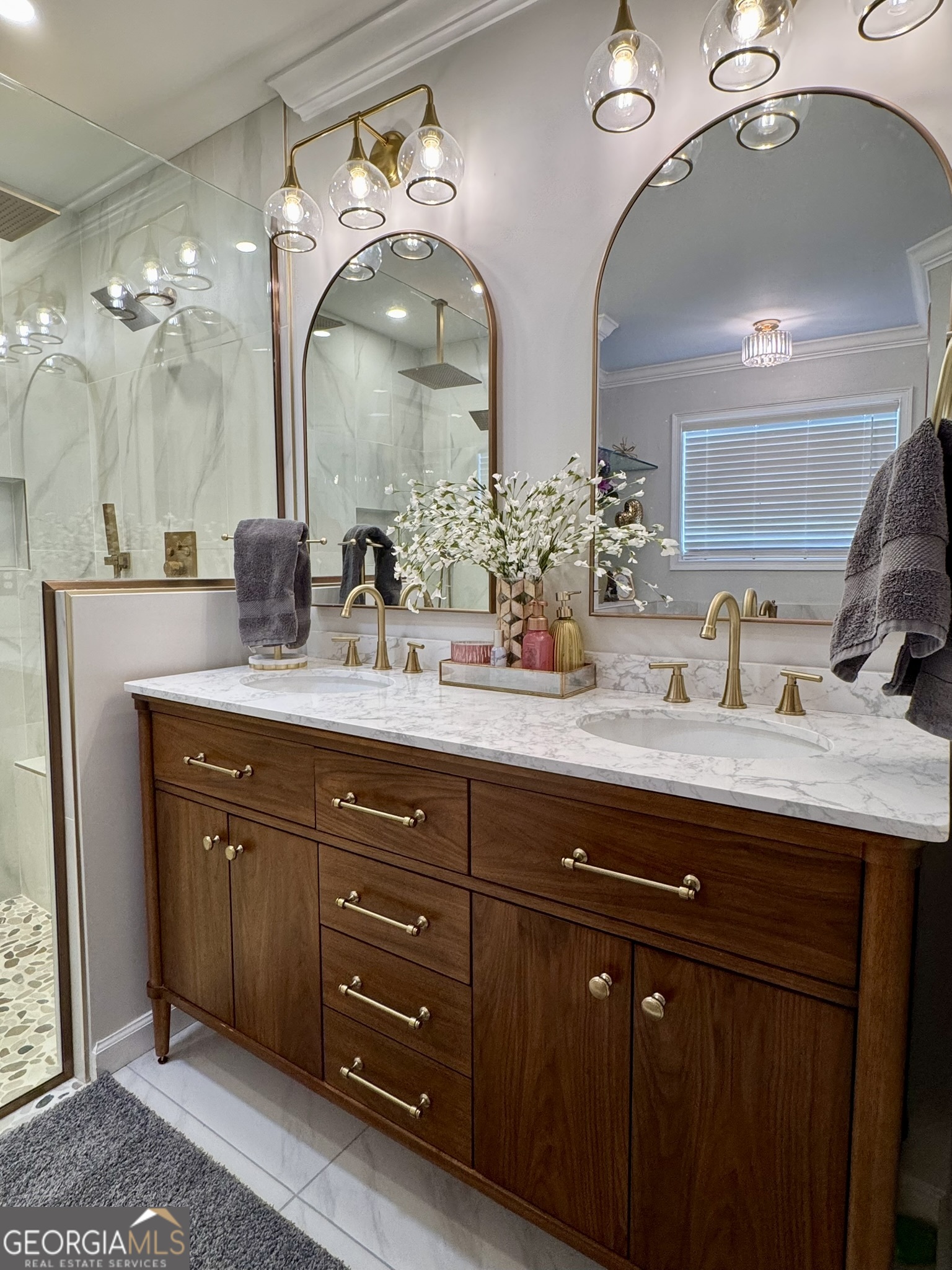 4633 Rustic Ridge Road Valdosta, GA 31602 - Photo 25 of 46 a bathroom with a double vanity sink and a mirror