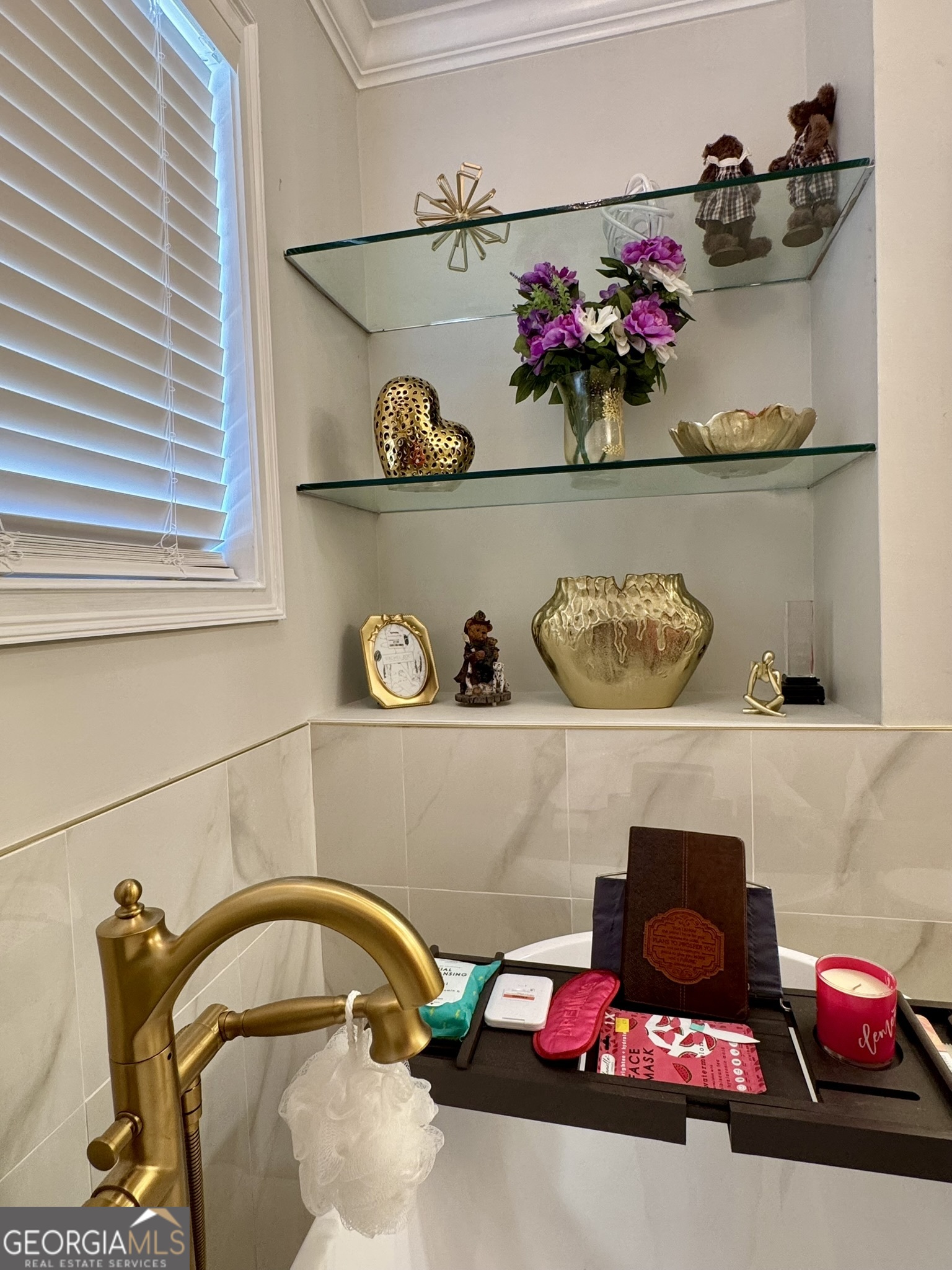 4633 Rustic Ridge Road Valdosta, GA 31602 - Photo 28 of 46 a bathroom with a sink and shelf
