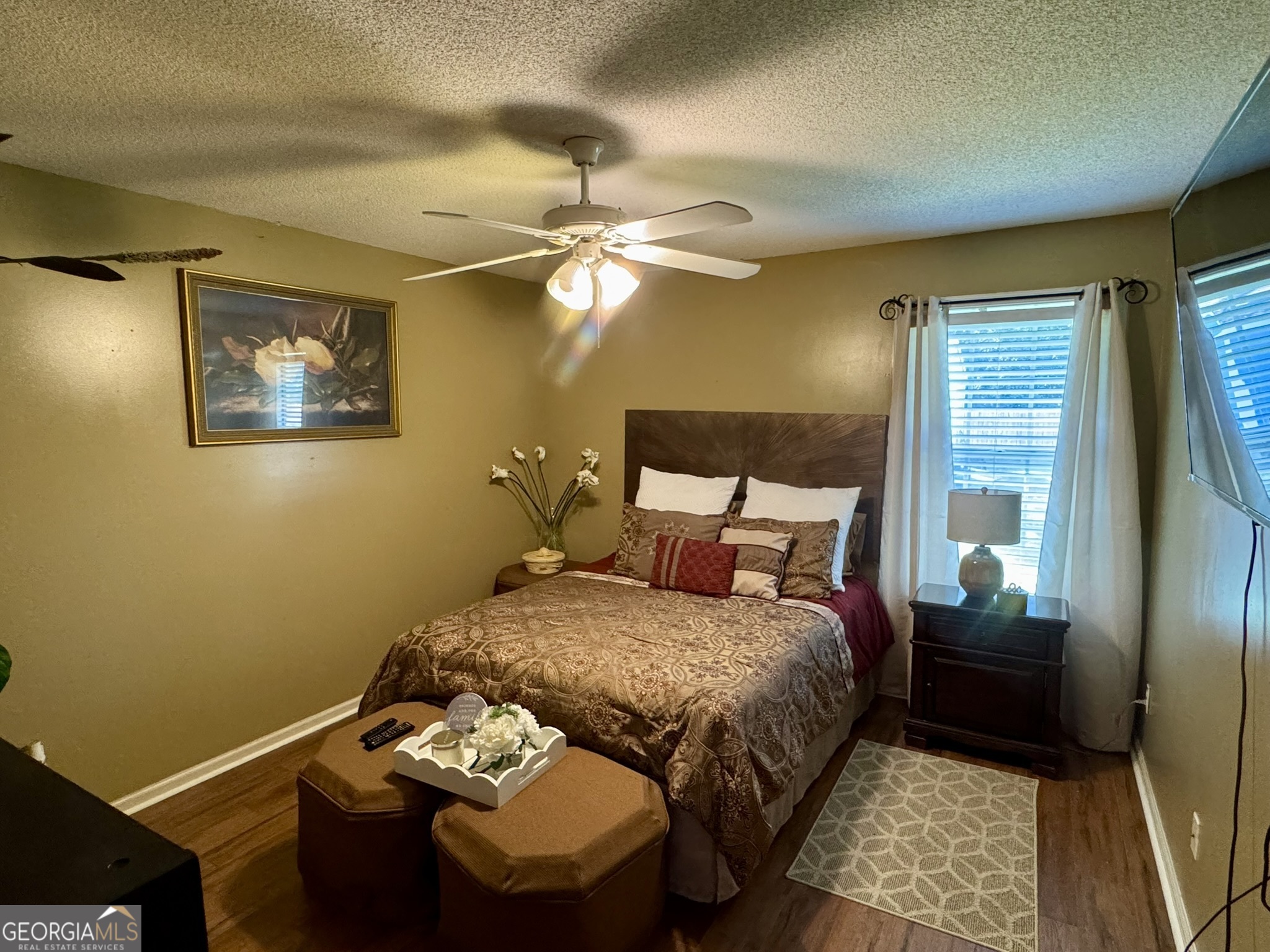 4633 Rustic Ridge Road Valdosta, GA 31602 - Photo 30 of 46 a bedroom with a bed and a chandelier