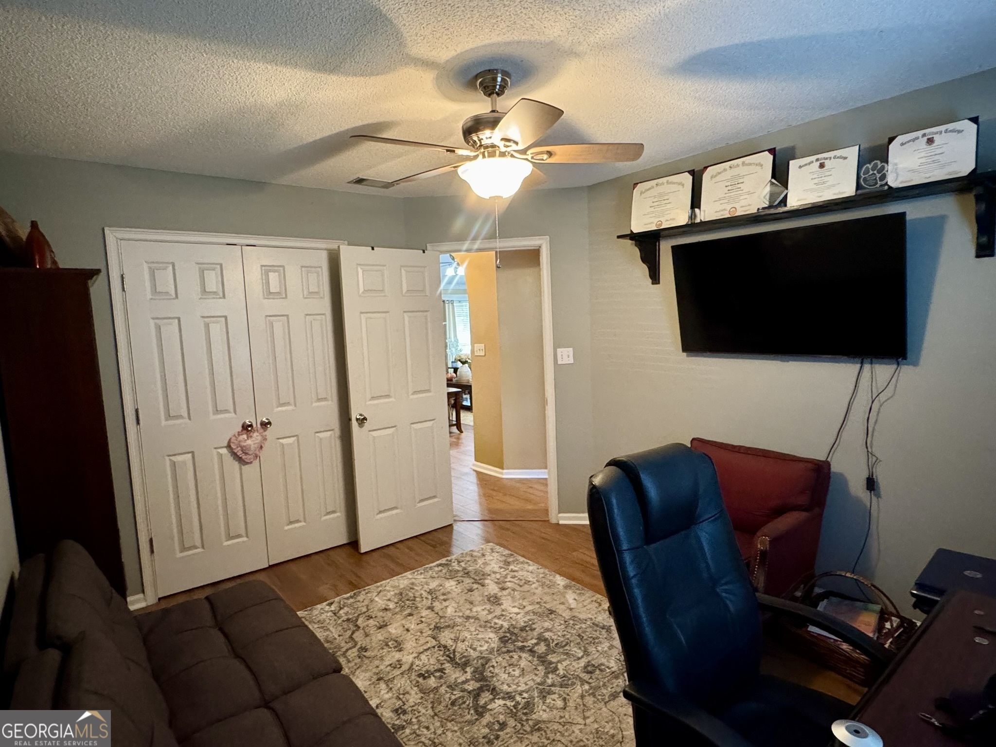 4633 Rustic Ridge Road Valdosta, GA 31602 - Photo 33 of 46 a living room with furniture and a flat screen tv