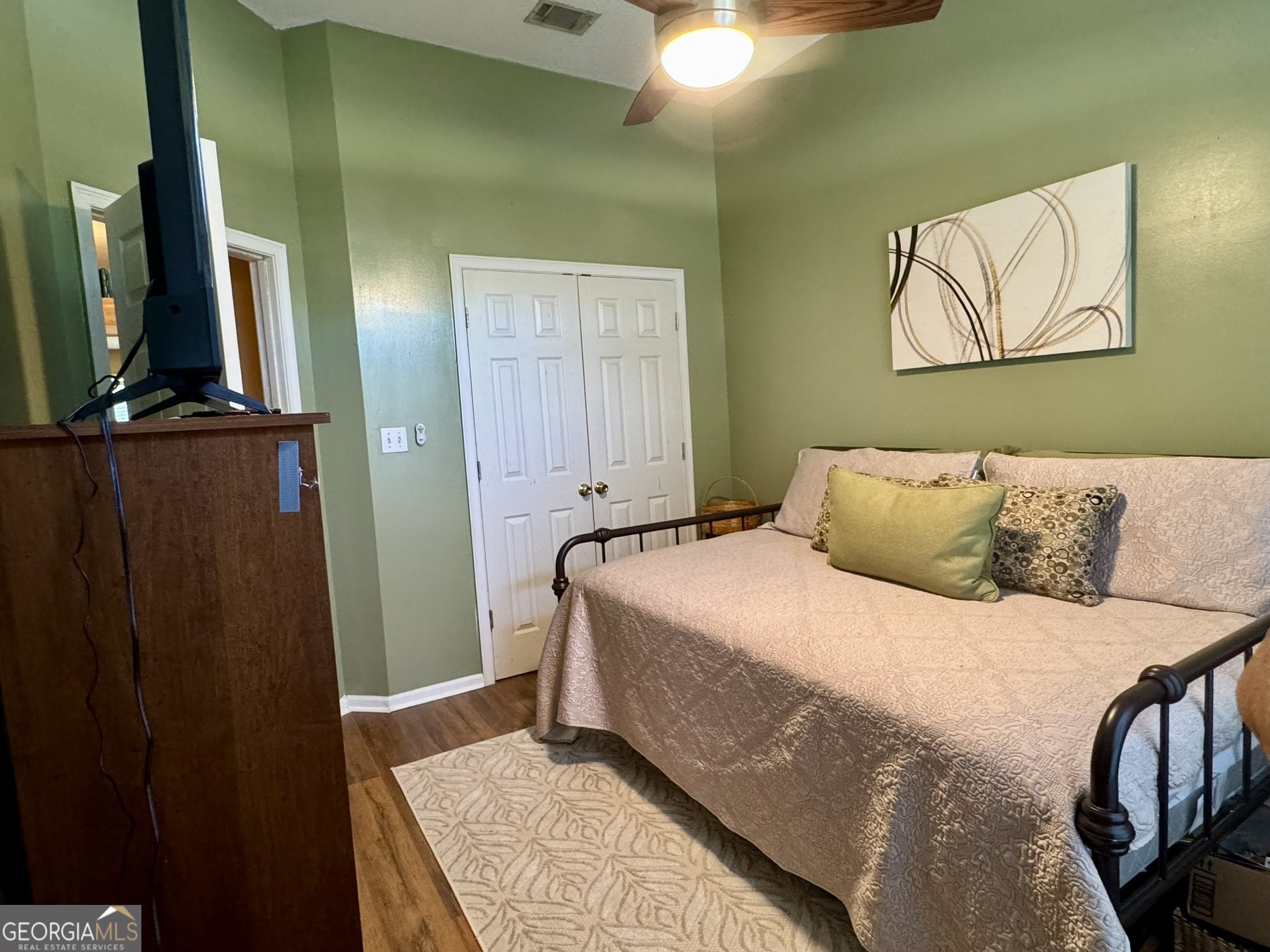 4633 Rustic Ridge Road Valdosta, GA 31602 - Photo 34 of 46 a bedroom with a bed and a mirror