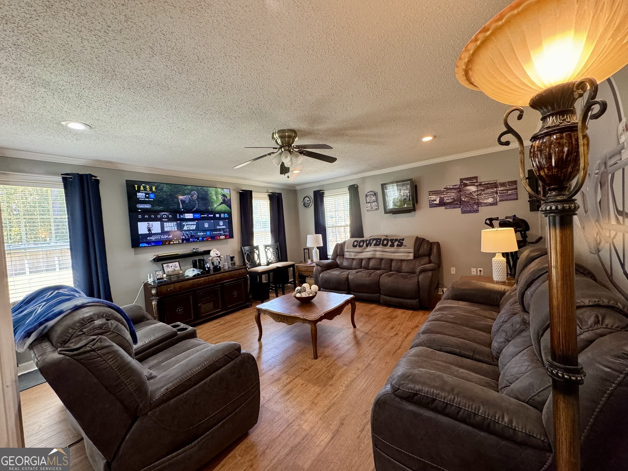 4633 Rustic Ridge Road Valdosta, GA 31602 - Photo 37 of 46 a living room with furniture a flat screen tv and a window