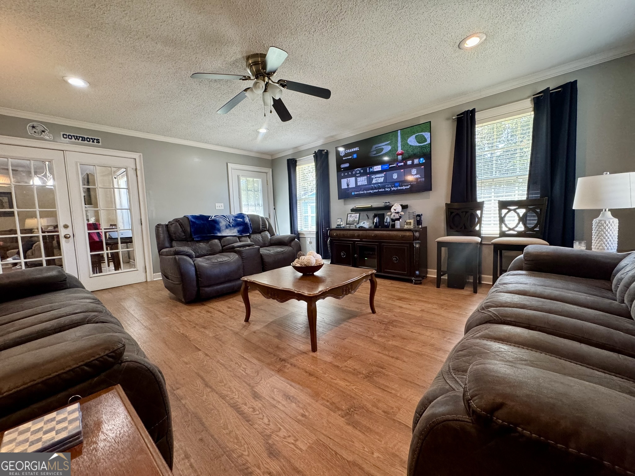 4633 Rustic Ridge Road Valdosta, GA 31602 - Photo 39 of 46 a living room with furniture and a flat screen tv