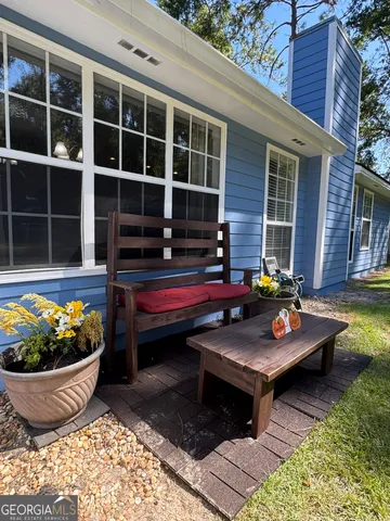 a outdoor space with patio and a garden