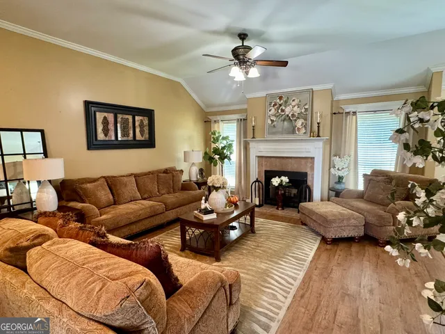 a living room with furniture and a fireplace