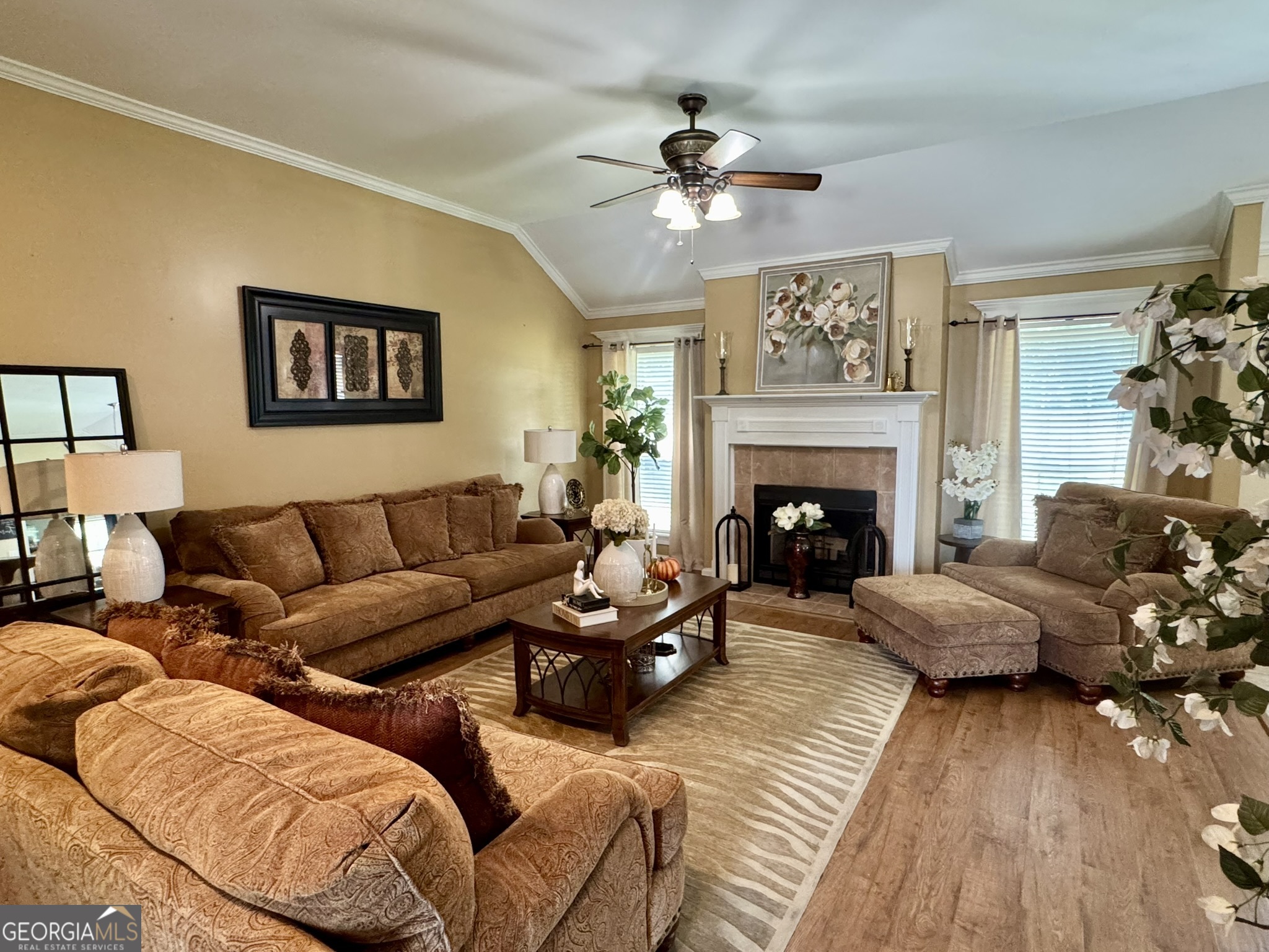 4633 Rustic Ridge Road Valdosta, GA 31602 - Photo 6 of 46 a living room with furniture and a fireplace