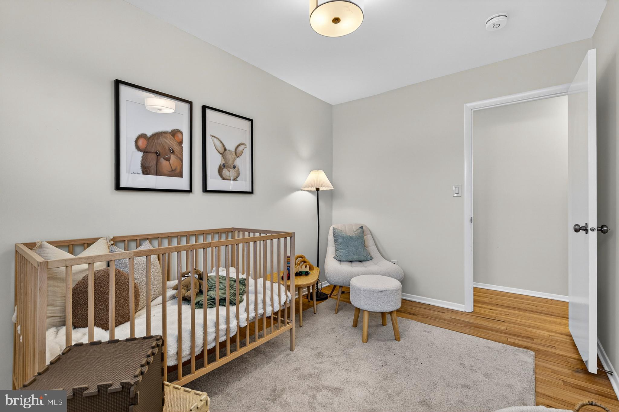 9223 Sandra Park Road Perry Hall, MD 21128 - Photo 15 of 27 a living room with furniture and a baby crib