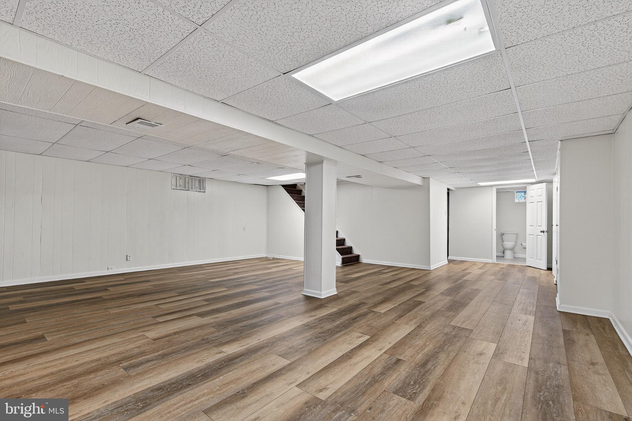 9223 Sandra Park Road Perry Hall, MD 21128 - Photo 16 of 27 a view of empty room with wooden floor