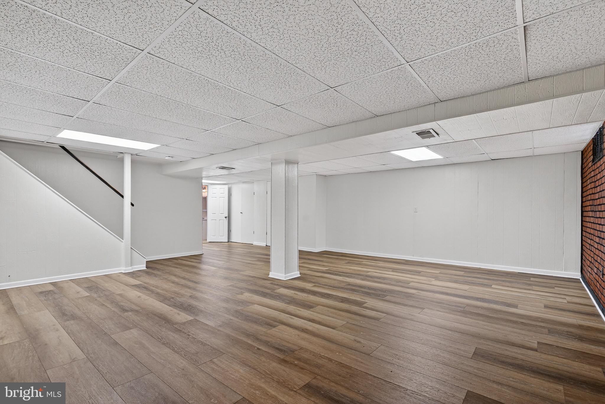 9223 Sandra Park Road Perry Hall, MD 21128 - Photo 17 of 27 a view of an empty room with wooden floor