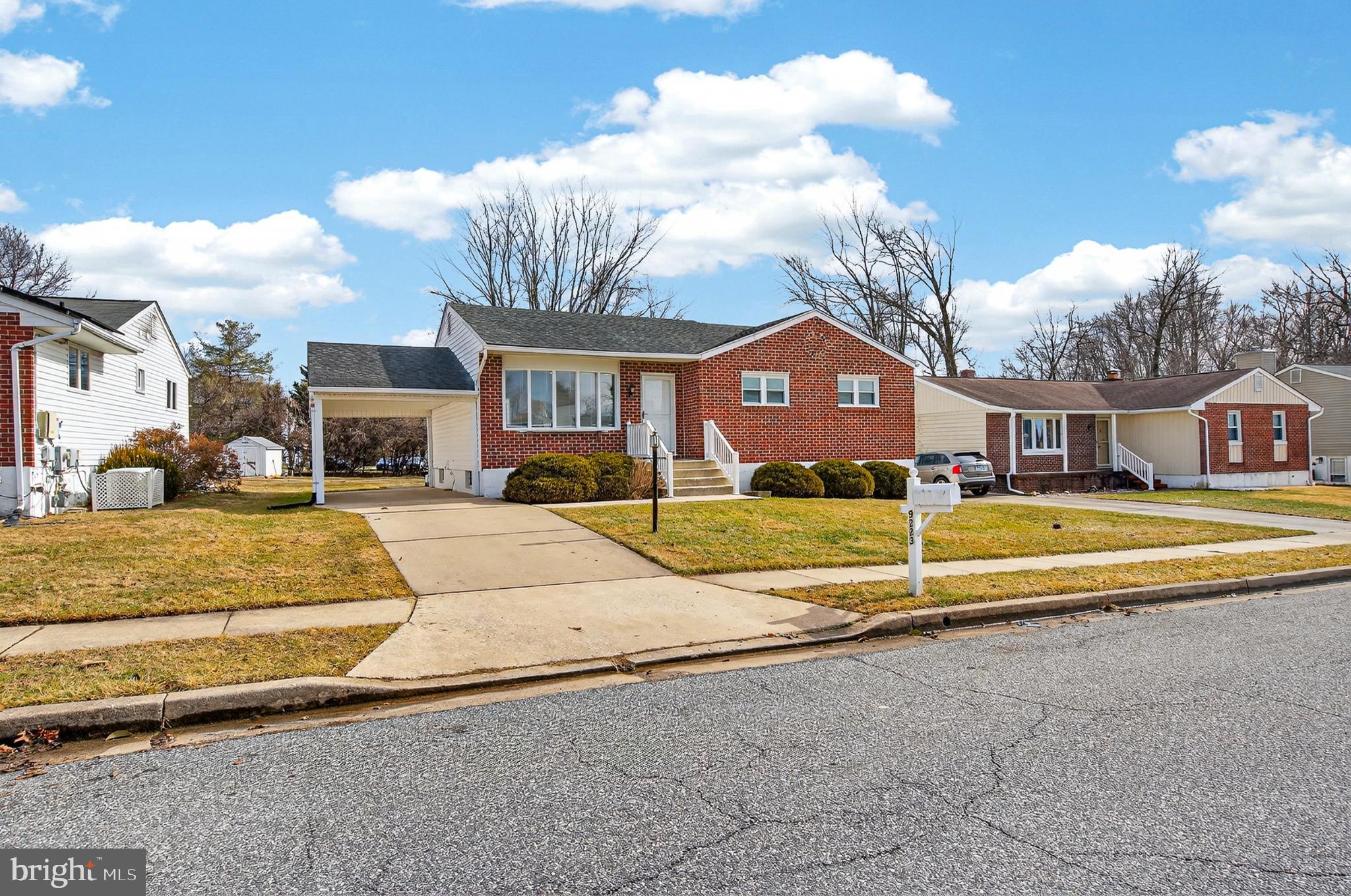 9223 Sandra Park Road Perry Hall, MD 21128 - Photo 25 of 27 a view of a house with a big yard and large trees