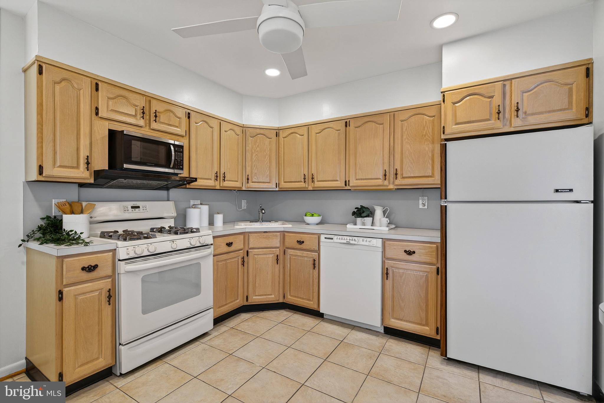 9223 Sandra Park Road Perry Hall, MD 21128 - Photo 6 of 27 a kitchen with granite countertop cabinets stainless steel appliances and a sink