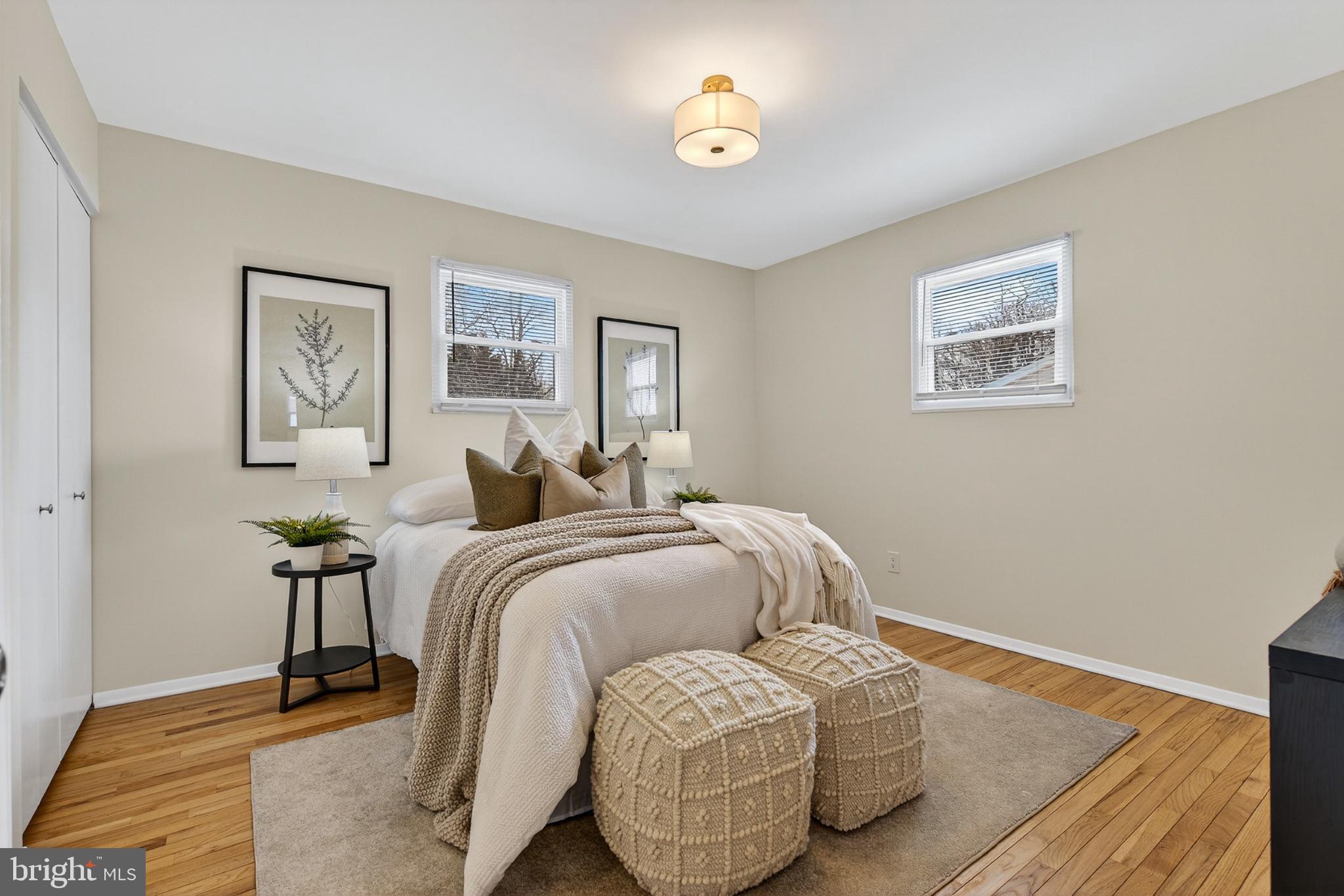 9223 Sandra Park Road Perry Hall, MD 21128 - Photo 8 of 27 a spacious bedroom with a bed and painting on the wall