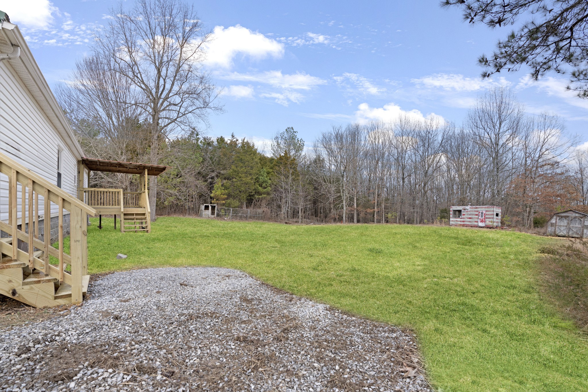 4227 Old Metal Road Palmyra, TN 37142 - Photo 15 of 16 a view of a backyard with large trees