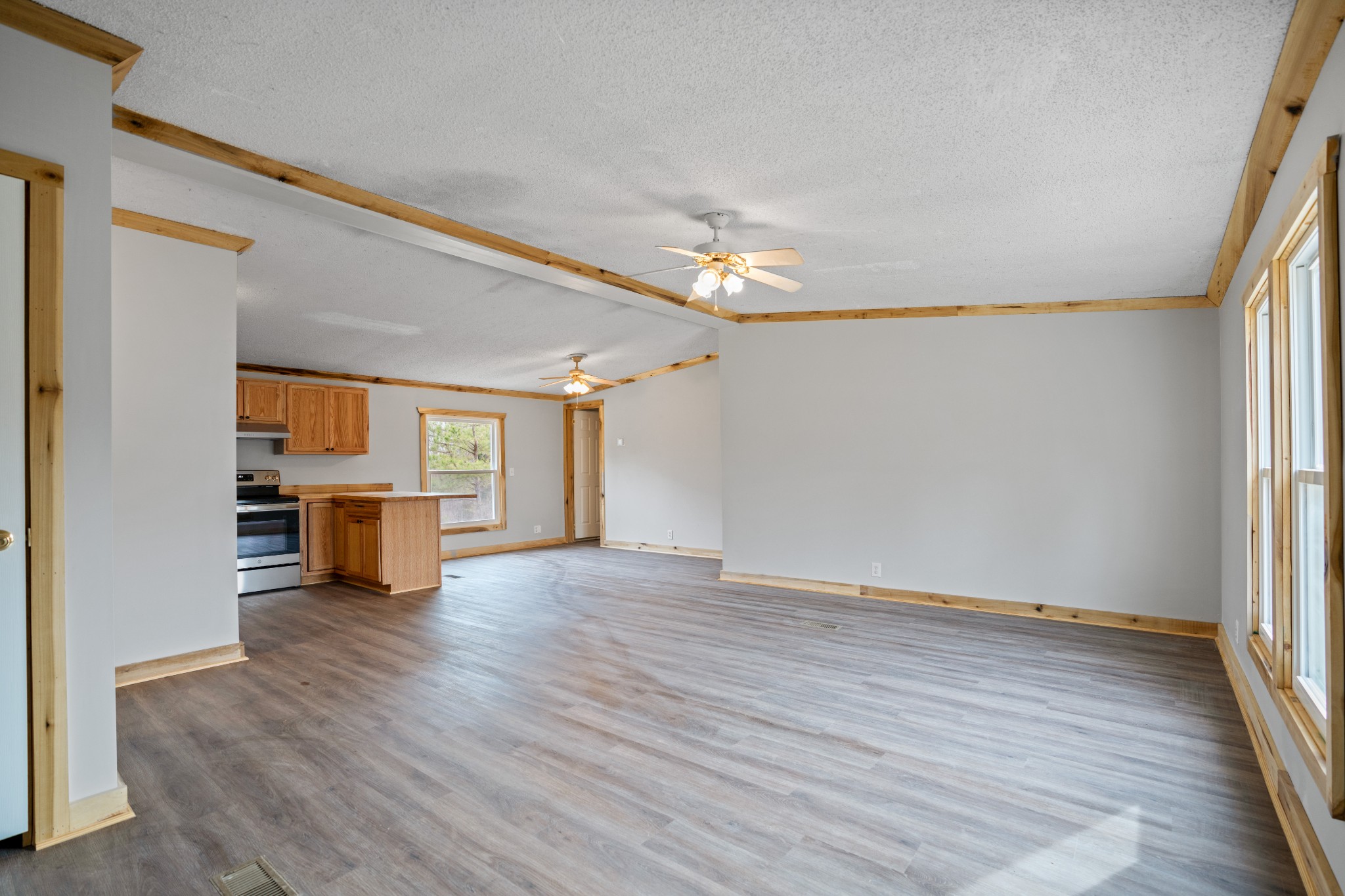 4227 Old Metal Road Palmyra, TN 37142 - Photo 4 of 16 wooden floor in an empty room with a window