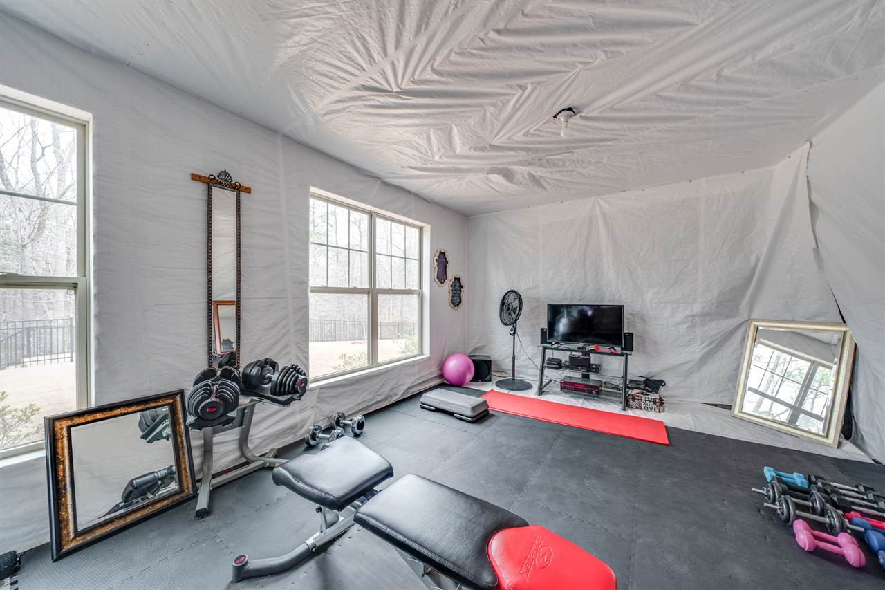 2212 Big Lake Court Raleigh, NC 27607 - Photo 26 of 30 Temporary workout room created in the unfinished basement.