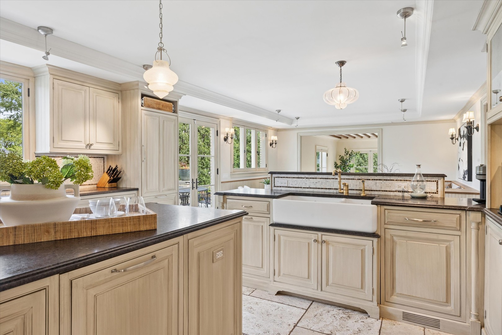 325 Princeton Road Hinsdale, IL 60521 - Photo 13 of 55 a kitchen with kitchen island granite countertop white cabinets and white appliances