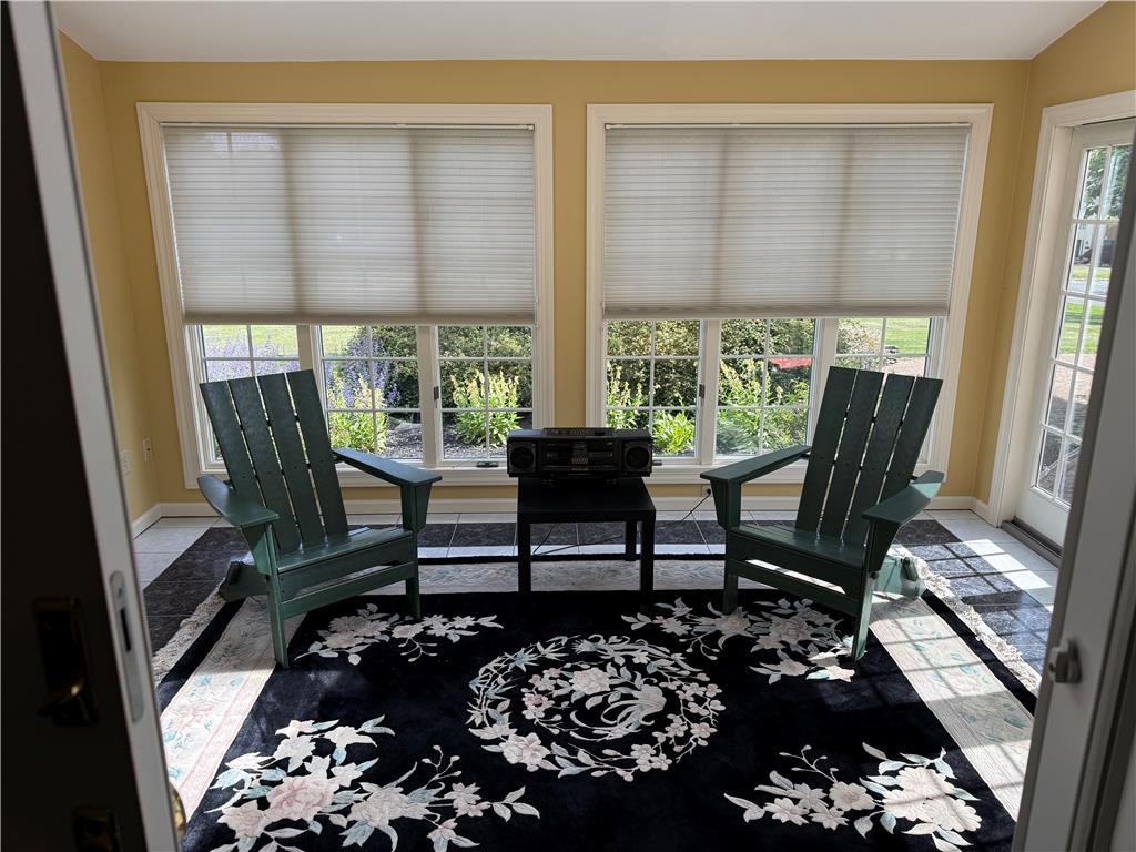 4114 Rochelle Drive Allentown, PA 18104 - Photo 15 of 35 Garden-facing sunroom provides a serene retreat, ideal for relaxation.