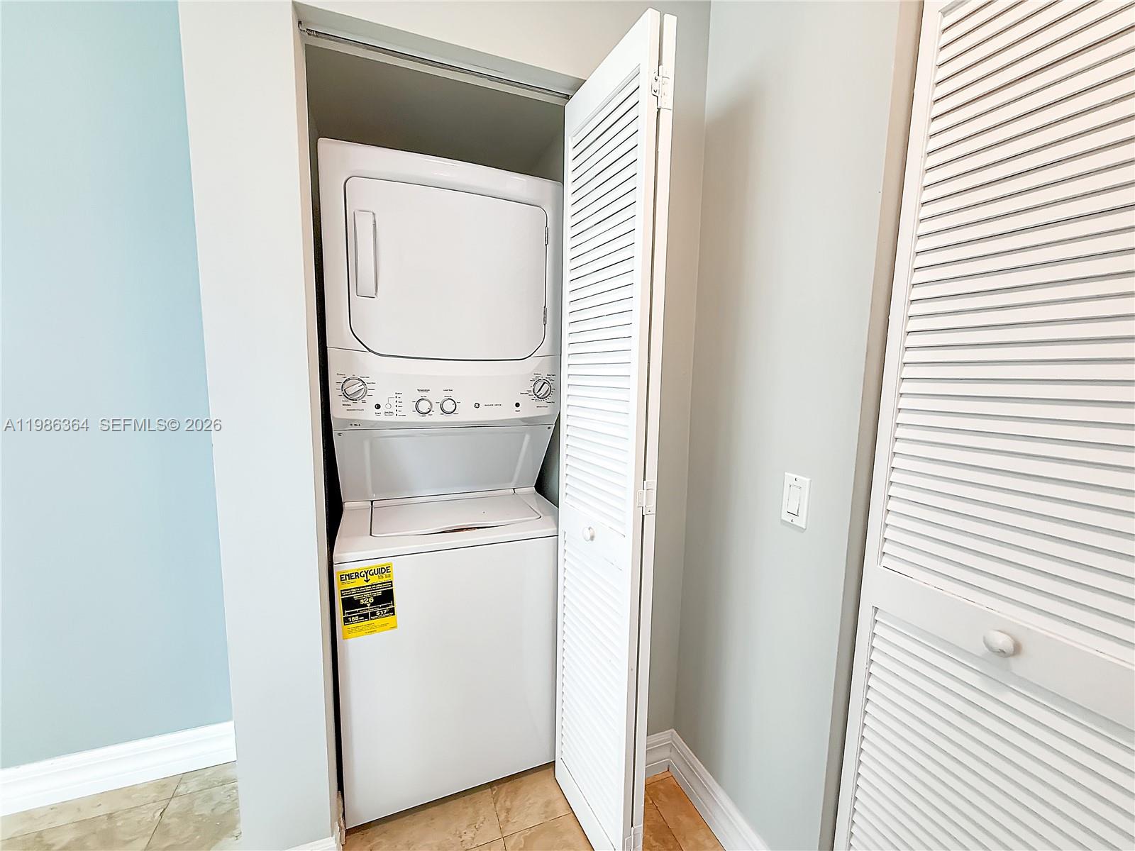41 Southeast 5th Street, Unit 602 Miami, FL 33131 - Photo 22 of 43 a utility room with dryer and washer