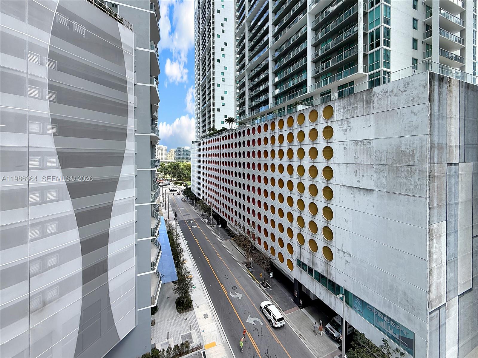 41 Southeast 5th Street, Unit 602 Miami, FL 33131 - Photo 25 of 43 a view of balcony with wooden floor and windows