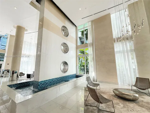 a living room with a table and chair