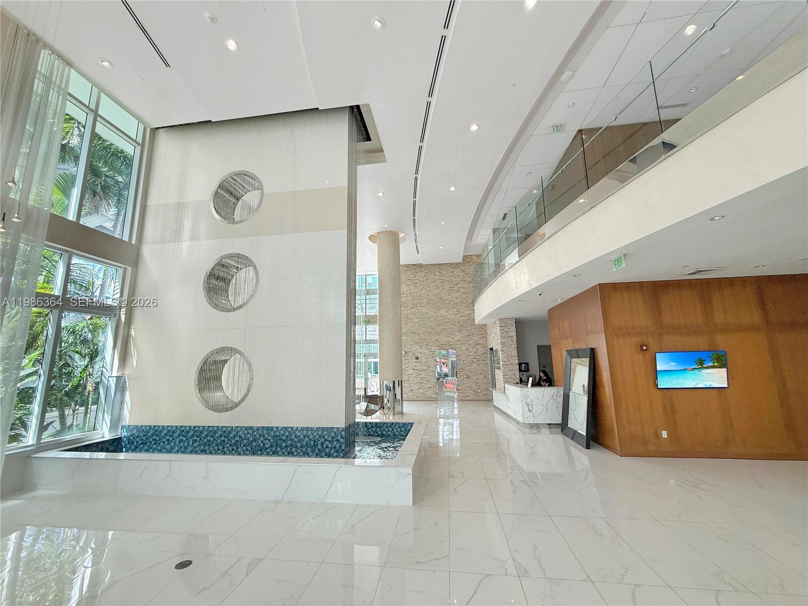 41 Southeast 5th Street, Unit 602 Miami, FL 33131 - Photo 29 of 43 a view of a hallway with wooden floor
