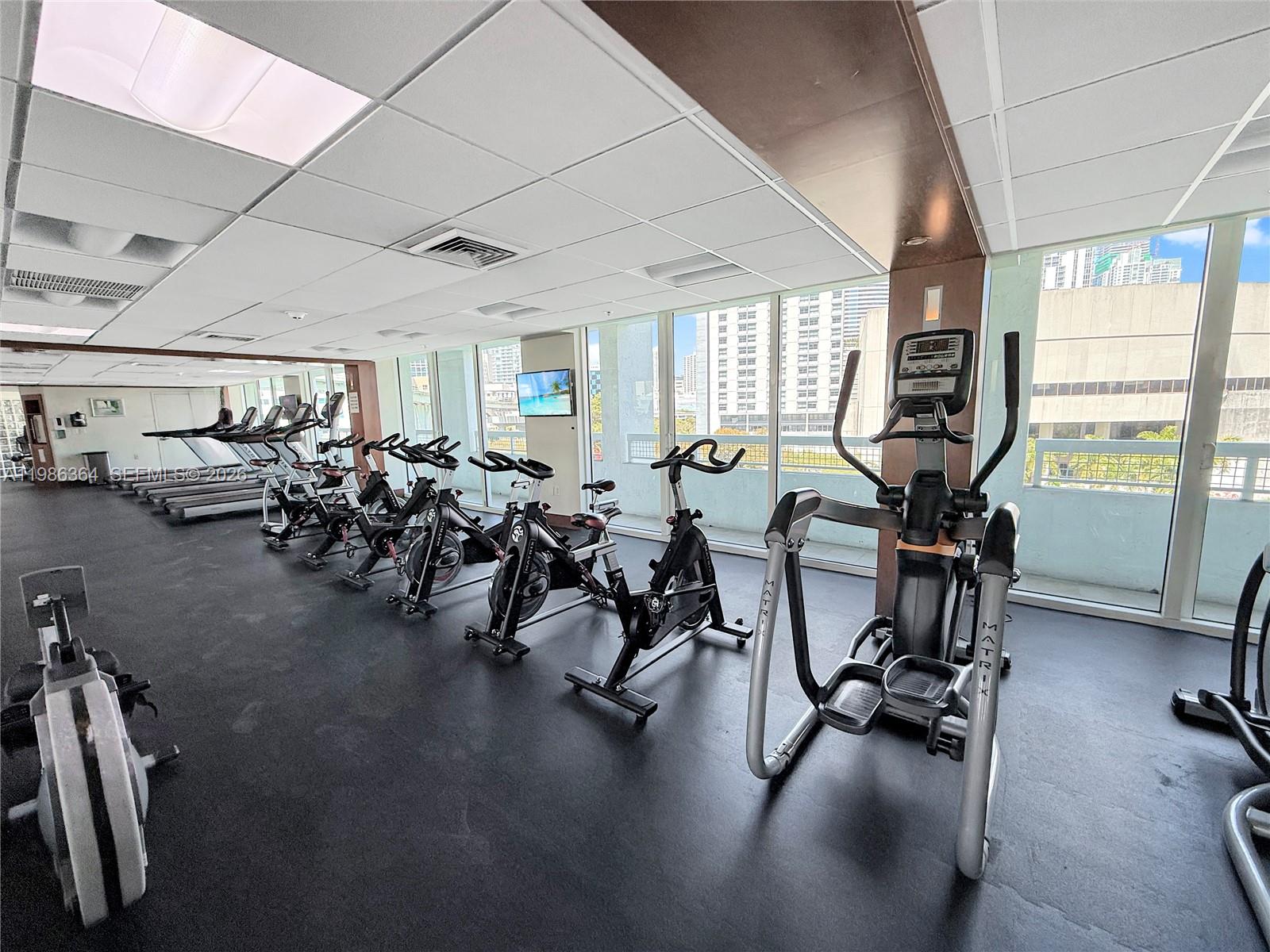 41 Southeast 5th Street, Unit 602 Miami, FL 33131 - Photo 32 of 43 a view of a room with gym equipment