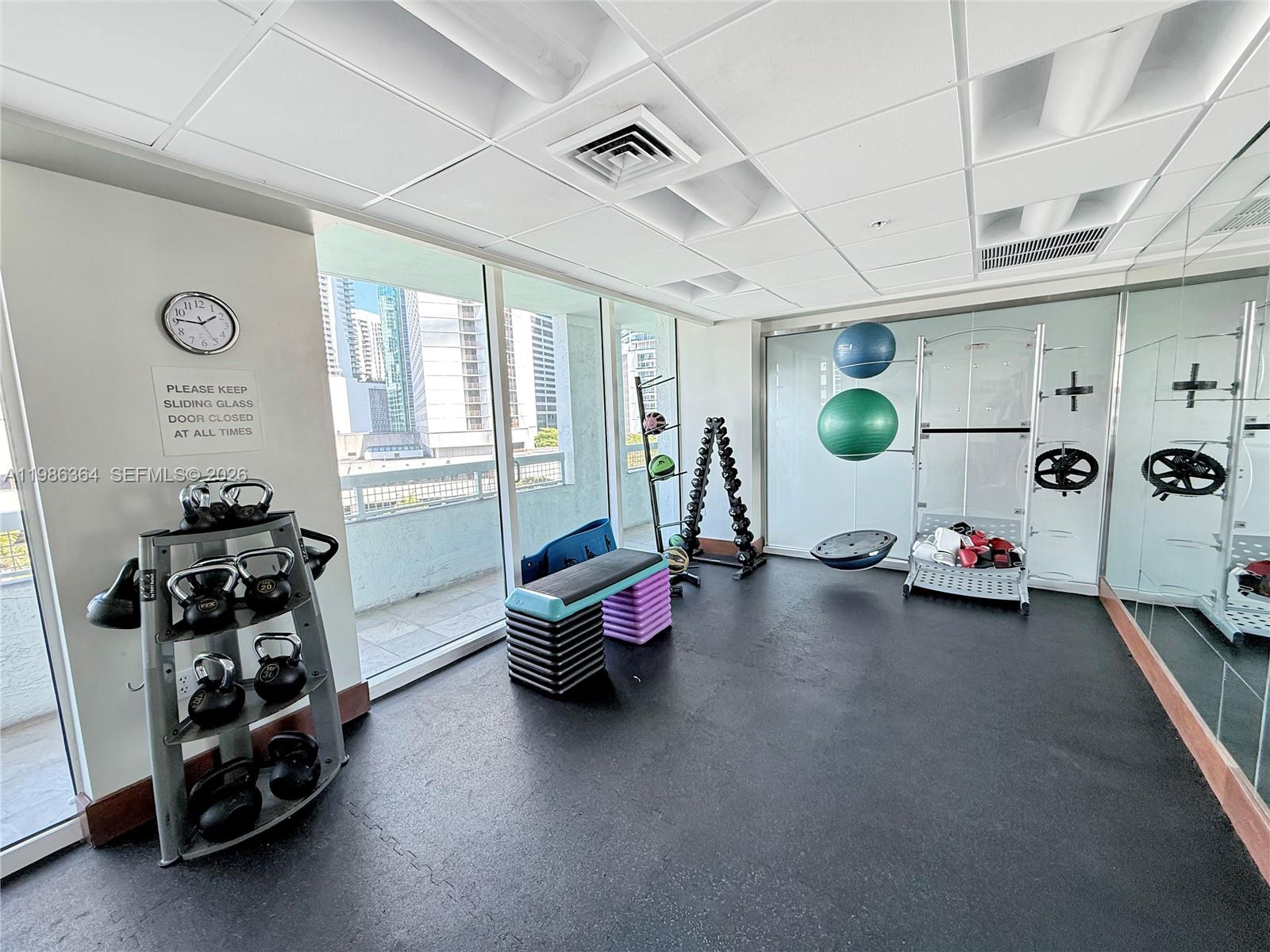 41 Southeast 5th Street, Unit 602 Miami, FL 33131 - Photo 35 of 43 a view of a room with gym equipment