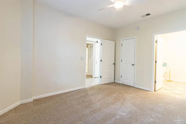 a spacious bathroom with a mirror a sink and a mirror