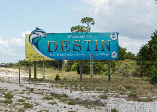 a sign broad on the side of the road